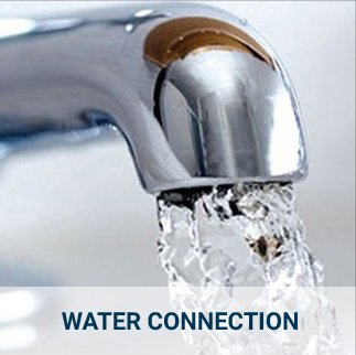 Water flowing from a stainless steel tap